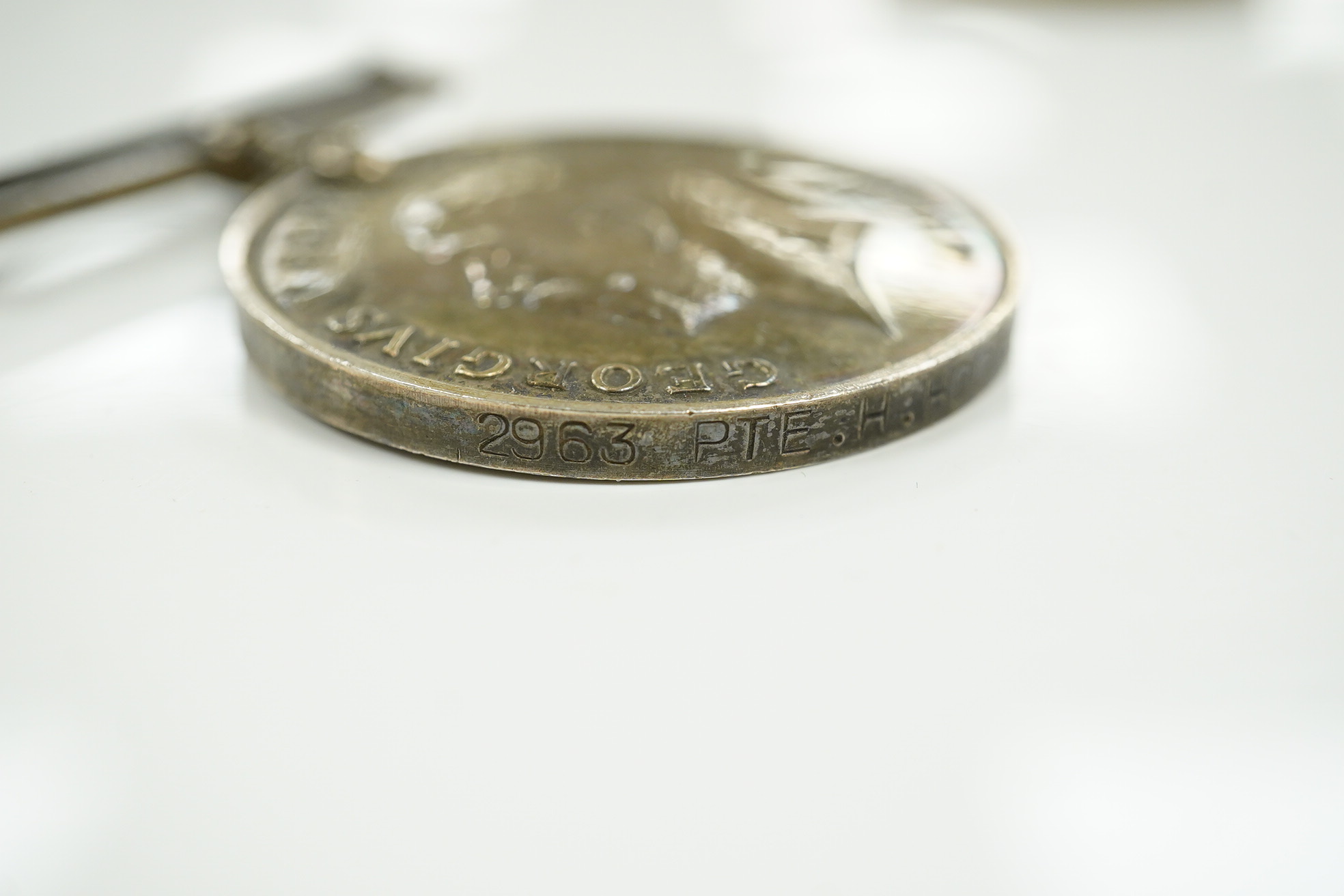 A First World War three medal group awarded to Pte. H. Hood R.W. Kent comprising; an India medal with bar for Afghanistan N.W.E. 1919, a War Medal and Victory Medal, plus an additional Victory Medal awarded to 2. Lieut.